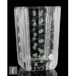 A post war Kosta Boda glass vase of rectangular form, cut and polished with stars and ovals, with
