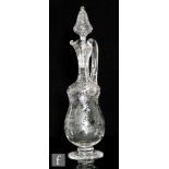 A late 19th Century Stevens & Williams clear crystal glass claret jug, the footed double gourd