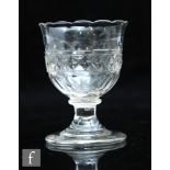An 18th Century syllabub glass circa 1780, the ovoid bowl with everted scalloped rim with flat cut