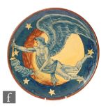 A late 19th Century plate decorated with a hand painted winged male nude holding a trumpet against a