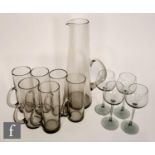 A 1970s Caithness lemonade set comprising tall jug and six cylindrical glasses all with a loop