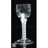 An 18th Century wine glass circa 1770, the ovoid bowl above a double series opaque twist stem with a