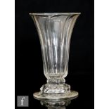 An 18th Century jelly glass circa 1750, the slated round funnel bowl with panel moulding above a