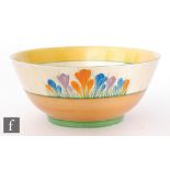 A Clarice Cliff Havre fruit bowl decorated in the Crocus pattern within brown and green banding,