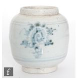 A Chinese 17th/18th Century blue and white glazed jar of rounded form, the white body glazed with