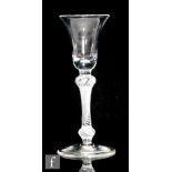 An 18th Century drinking glass circa 1760, the bell bowl above a double knopped stem with single