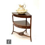 A George III mahogany corner washstand fitted with a drawer, together with a replica transfer