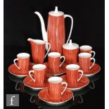 A post war Cmielow coffee service in the Goplana pattern in red with freeform white vertical lined