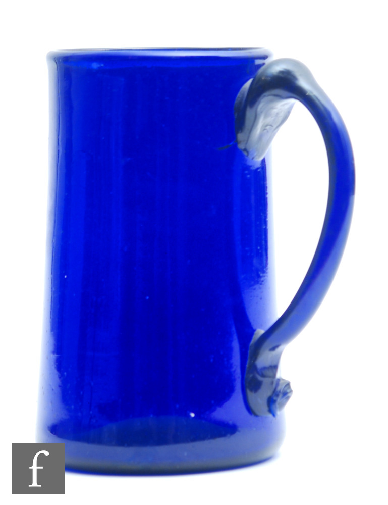 A late 18th Century Bristol Blue tankard, of tapering cylindrical form with applied handle, height
