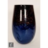 A later 20th Century Strathearn ovoid form vase, the mottled light and dark blue swirling ground