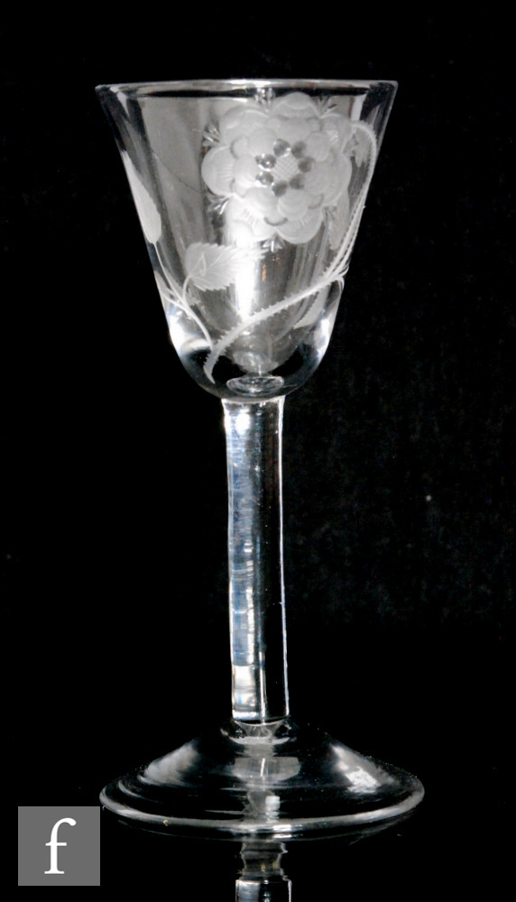 An 18th Century Jacobite drinking glass circa 1750, the round funnel bowl engraved with seven