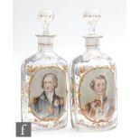 A pair of 19th Century continental decanters of rounded rectangular form with collar neck and hand