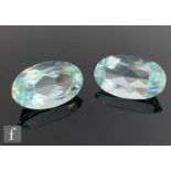 Two loose cut and polished oval aquamarine stones each length 22mm, width 12mm and depth 8mm, each