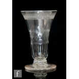 An 18th Century jelly glass circa 1770, the waisted round funnel bowl with a band of engraved