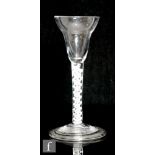An 18th Century drinking glass circa 1770, the pan topped bowl above a double series opaque twist