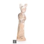 A Chinese Tang Dynasty (618-907) terracotta figure of a female attendant in standing pose with hands