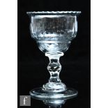 An 18th Century sweetmeat glass circa 1760, the double ogee bowl with notched rim and fluted