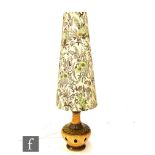 A post war West German 'fat lava' table lamp, the pierced base in mustard and sage green coloured