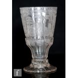 An 18th Century Silesian goblet circa 1740, the slice cut bowl heavily engraved with seated