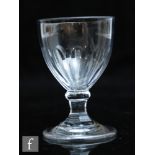 An 18th Century dram glass circa 1810, the ovoid bowl with basal slice cut decoration above a