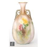 An early 20th Century Hadleys Worcester twin handled vase decorated with hand painted yellow and