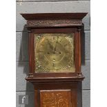 An 18th Century oak and mahogany cross-banded longcase clock with an eight day movement, the hood