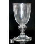 A large 20th Century clear crystal glass heavy baluster goblet in the 18th Century taste, the