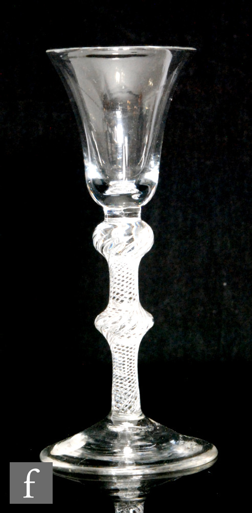 An 18th Century drinking glass circa 1760, the bell bowl above a double knopped, single series