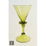 A 19th Century continental wine glass, the wrythen moulded conical bowl above a frill collar and a