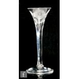 An 18th Century Jacobite drinking glass circa 1750, the trumpet bowl engraved with six petalled rose