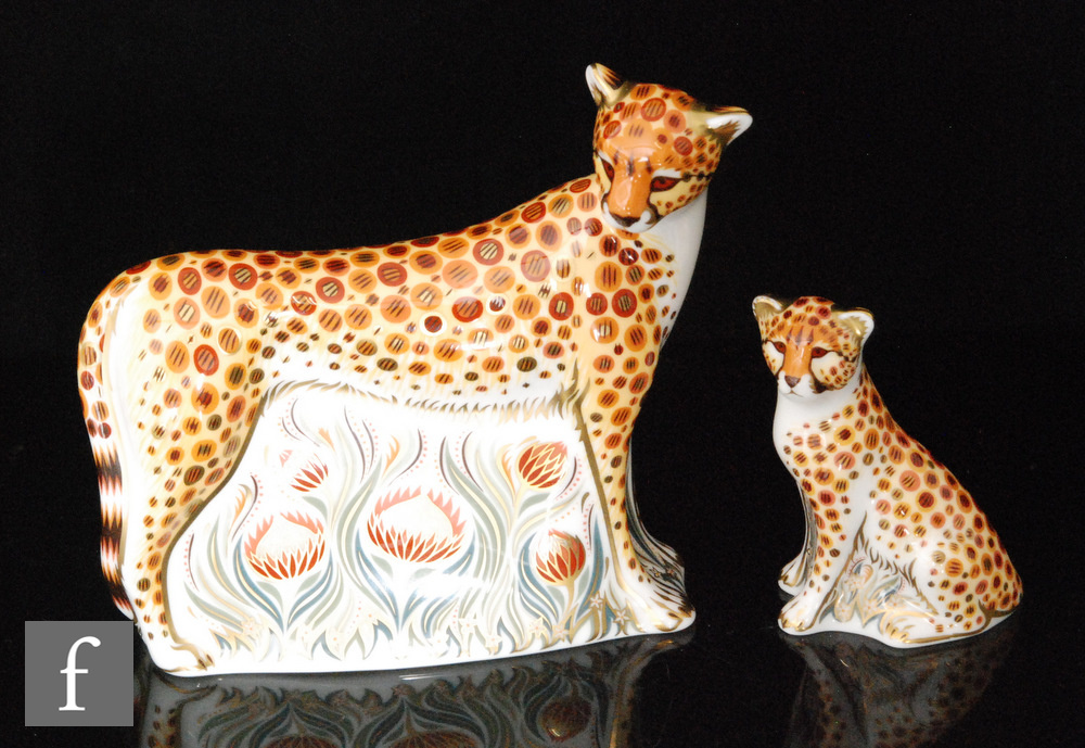 Two boxed Royal Crown Derby paperweights comprising Cheetah and Cheetah Cub, both with gold