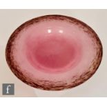 A 1930s Monart shallow glass bowl, shape DF, with deep purple and aventurine mottled rim to a pink