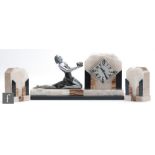 A 1930s Art Deco mantle clock, flanked by two pedestals, the slate, white onyx and variegated marble