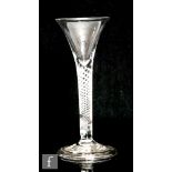 An 18th Century drinking glass circa 1750, the trumpet bowl above a multi air twist stem, raised