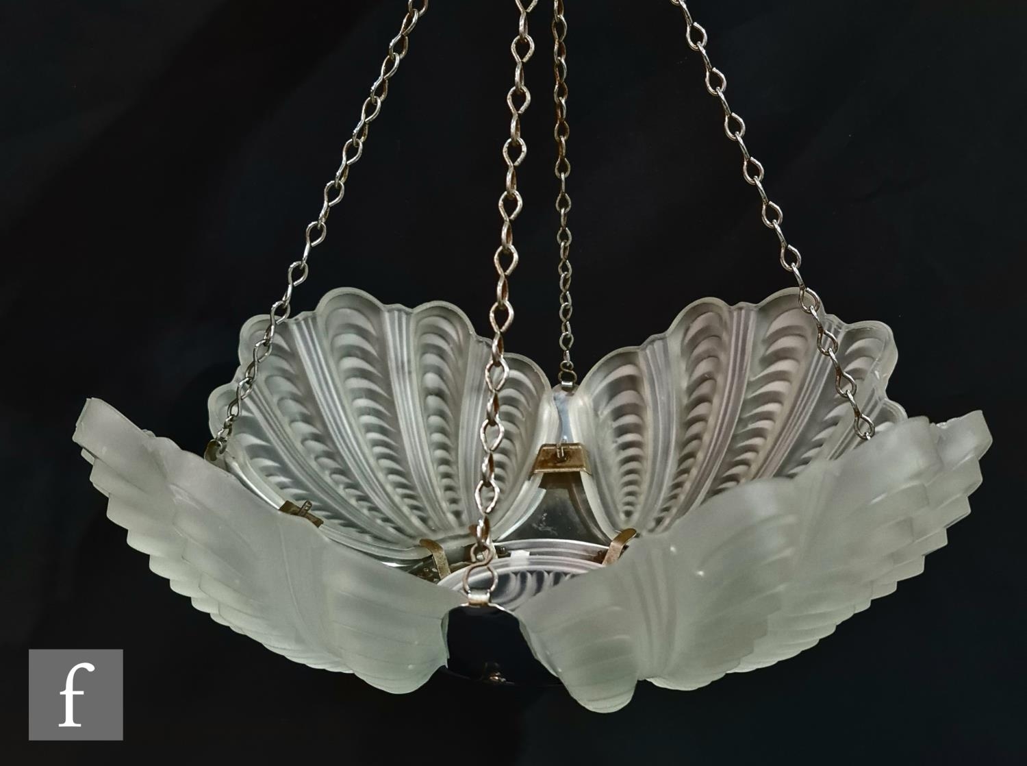 Two 1930s Art Deco light fittings, to include a quatrefoil shell shaped frosted glass ceiling