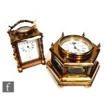 A replica octagonal brass desk clock with exposed glass panel sides, width 20cm, and a similar brass