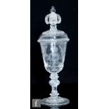 A 19th Century glass goblet and cover, the round funnel bowl with engraved initials LDG surrounded