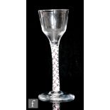 An 18th Century colour twist drinking glass circa 1770, the ogee bowl above a multi series opaque