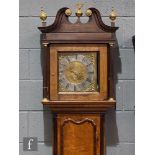 An 18th Century oak and mahogany cross-banded longcase clock with a thirty-hour movement striking on