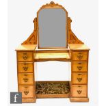 A late 19th Century ash dressing table in the Aesthetic taste, the upright section