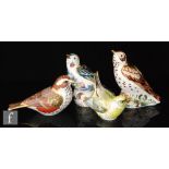 Four boxed Royal Crown Derby paperweights comprising a Collectors Guild Redwing, Greenfinch, The