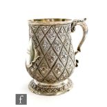 A Victorian hallmarked silver baluster pint tankard with matt finished diamond cut and leaf