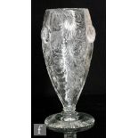 A late 19th to early 20th Century Hawkes of Stourbridge clear crystal glass vase of footed swollen