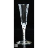 An 18th Century ale glass circa 1760, the funnel bowl above a double series opaque twist stem with a