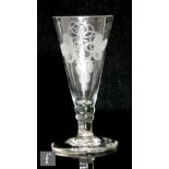A late 18th Century drinking glass, the round funnel bowl engraved with hops and barley, above a