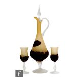 A later 20th Century glass footed decanter, the jug shaped body in a dark mustard with applied brown