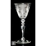 An 18th Century Newcastle light baluster drinking glass circa 1750, the large round funnel bowl