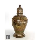 A Victorian Britannia silver urn and cover, circular foot below baluster body with embossed marks