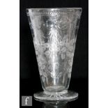 A large Tudor Crystal glass vase of footed conical form decorated in the Ribbon & Rose pattern by