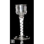 An 18th Century drinking glass circa 1770, the ogee bowl above a double series opaque twist stem